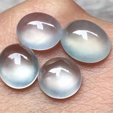 冰种蛋面，尺寸：9.9*8.2*4mm,7.9*3.6mm，完美起光，水润通透，起荧光。H15